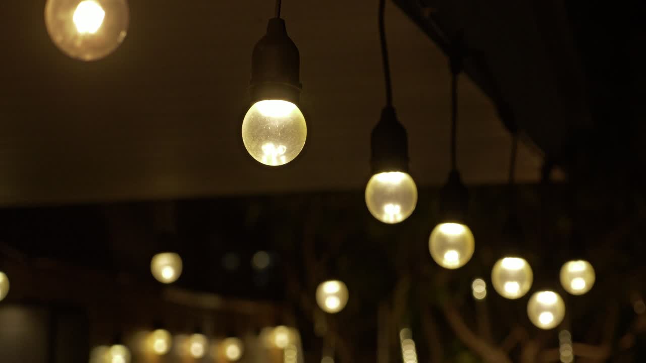 Illuminating festive evening string lights outdoor gatherings coziness nighttime atmosphere