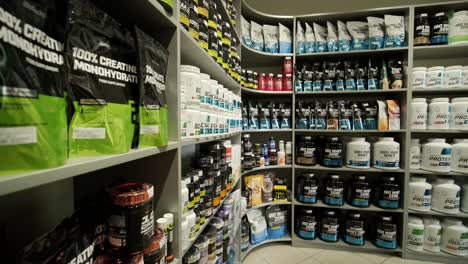 sport nutrition store interior with large choice of nutritional supplements.