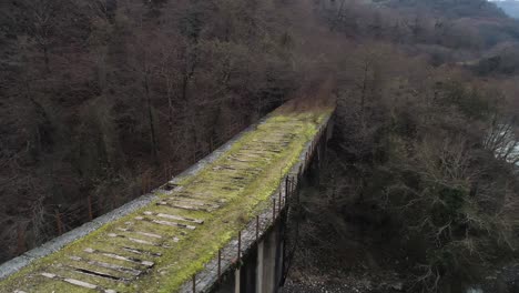 abandoned mountain bridge over a river