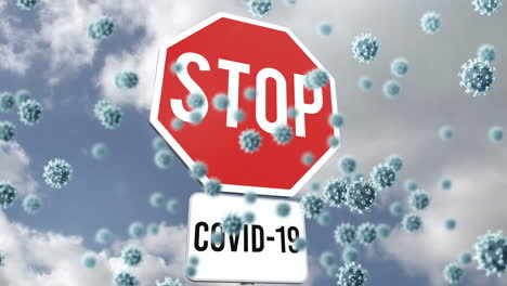 animation of stop sign with covid19 text over clouds and virus cells