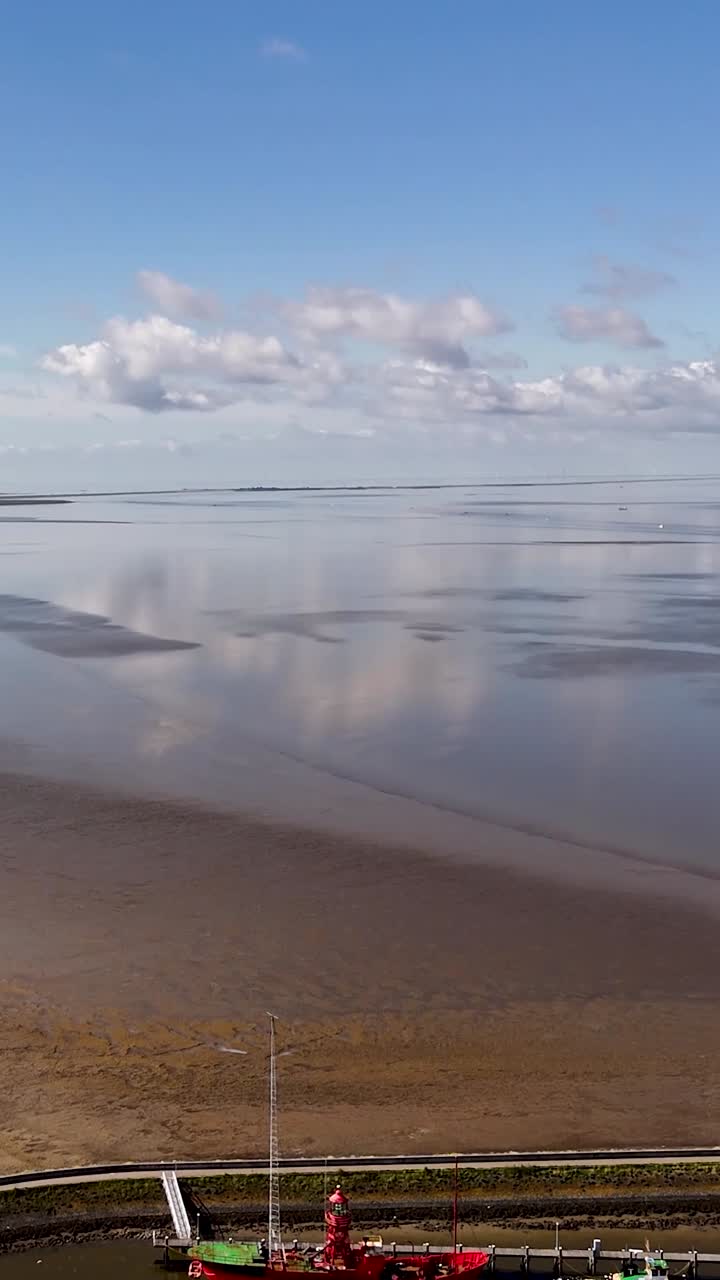 Coastal landscape with calm water and reflections