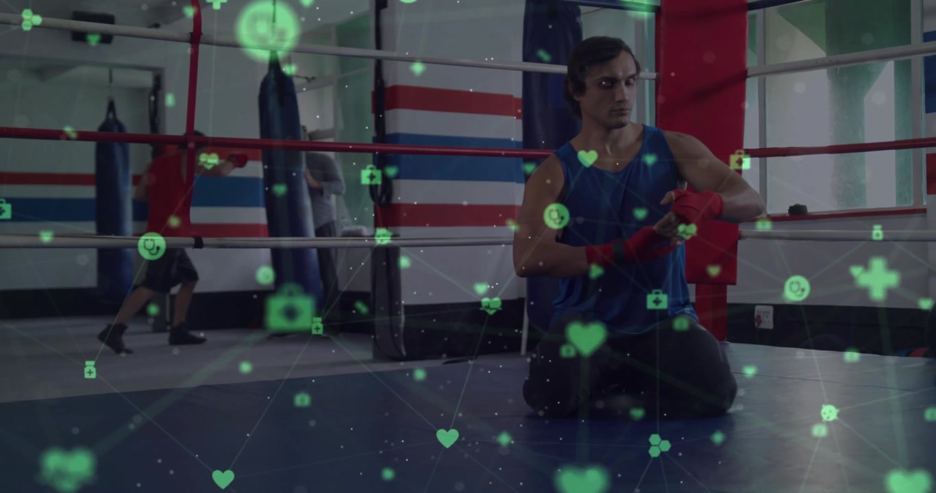 Boksör kırmızı sargıları çekiyor, spor salonu ringinde boks antrenmanı için ellerini sarıyor, nabız gibi atan sağlık simgeleriyle