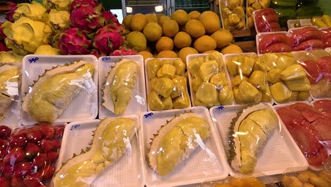 colorful tropical fruits beautifully arranged for sale