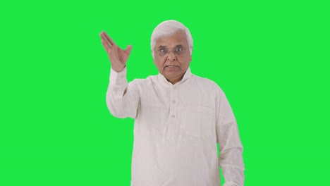 Angry-Indian-old-man-shouting-on-someone-Green-screen