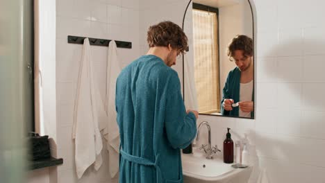 man washing hands in the bathroom