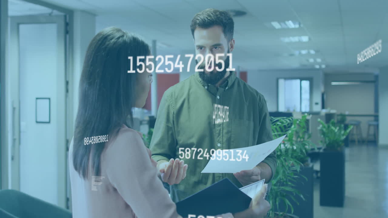 Two colleagues discussing documents with floating numbers animation in office