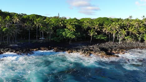 rotating flight around hawaii island beach with cars moving along the road