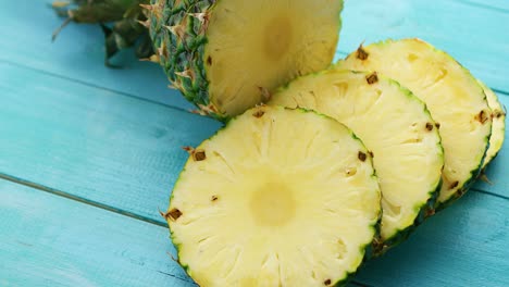 slices of pineapple on blue wood