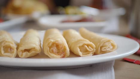 spring rolls being picked up