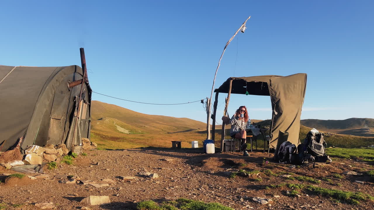 Woman Camping in the Mountains