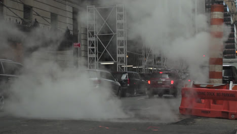 An-underground-manhole-in-New-York-City-seems-to-be-spewing-more-steam-in-the-air-than-normal