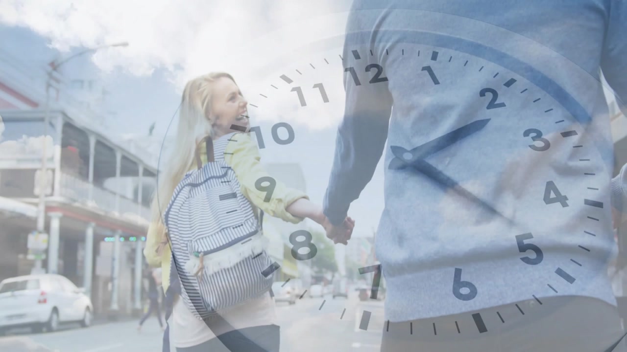 Couple entering frame walking holding hands under clock overlay, marking time passage in marketing