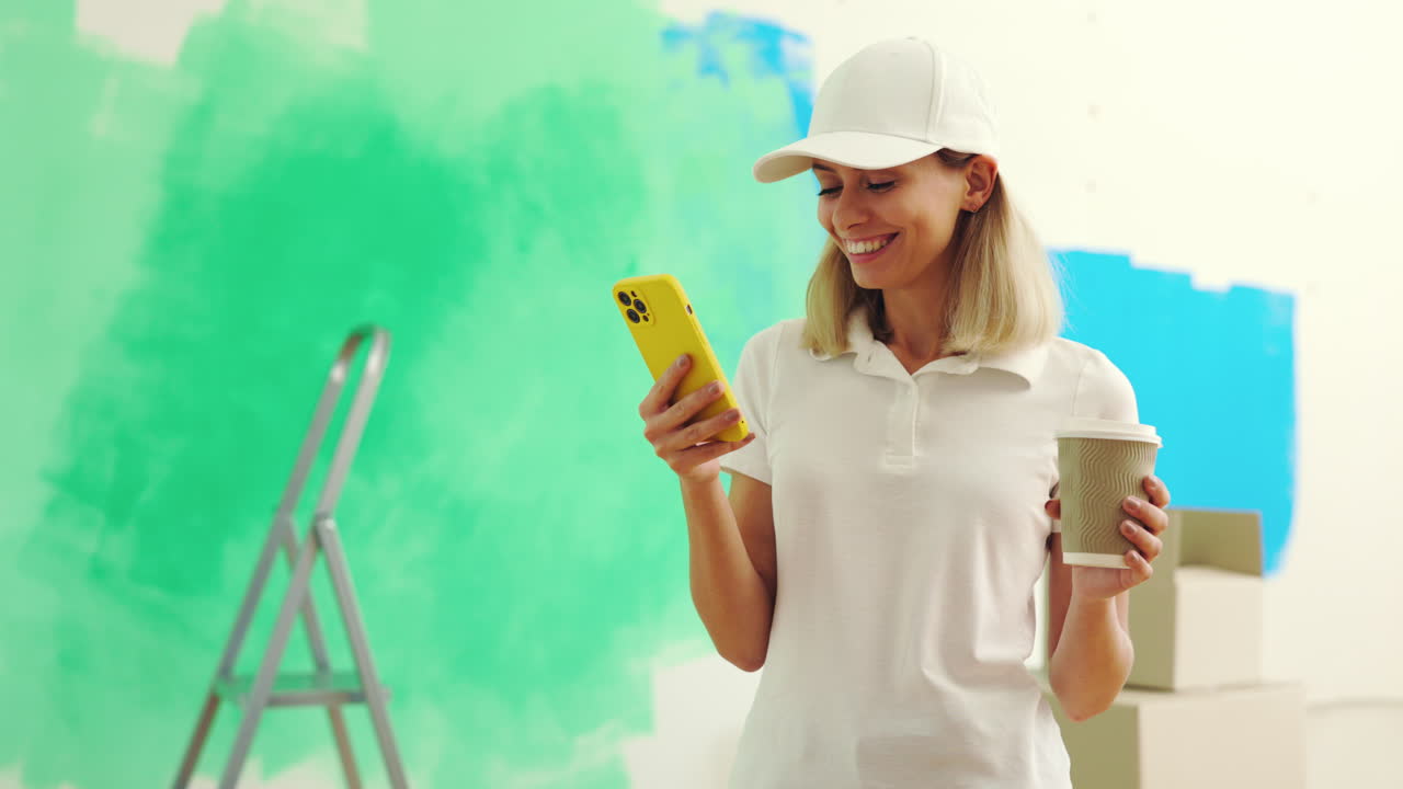 Woman using phone during home renovation