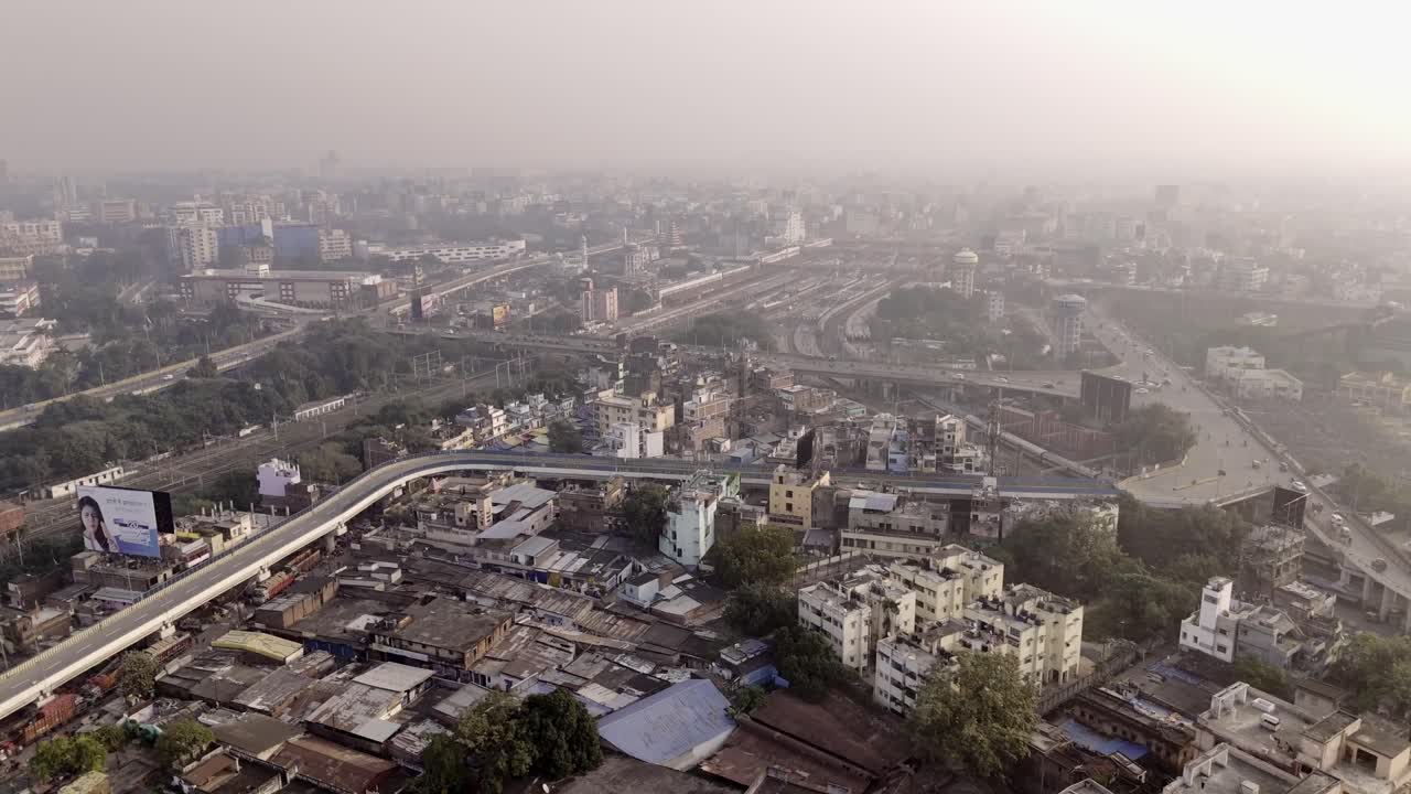 Mithapur overbridge road, Patna railway station and city covered under hazy sky in summer due to air pollution and climate change, Drone shot
