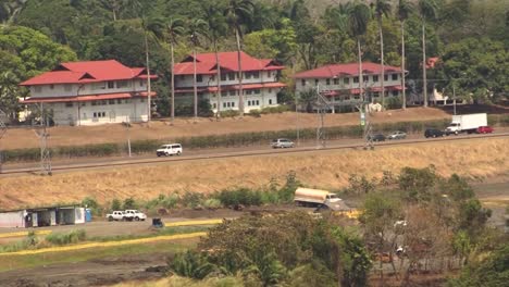 Traffic-and-buildings-around-Miraflores-Locks,-Panama-Canal