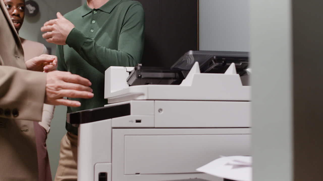 People working with an office printer