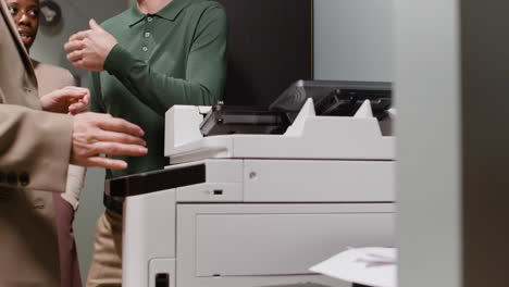 people working with an office printer