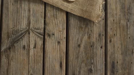 video of rosemary twig and spoon of salt on wooden background