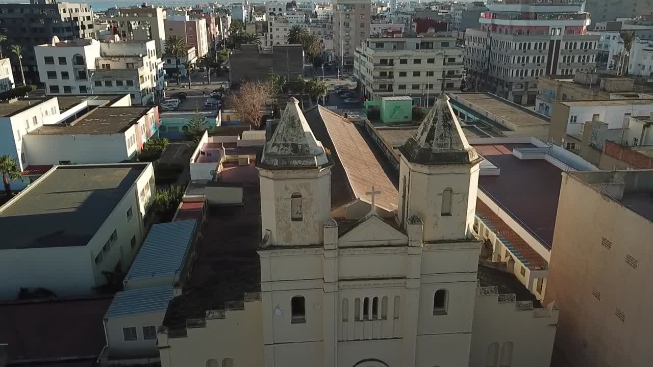 Aerial view of the historic San Jose Church in Al Hoceima, Morocco. This drone footage showcases the Spanish colonial architecture of this landmark in the Rif region