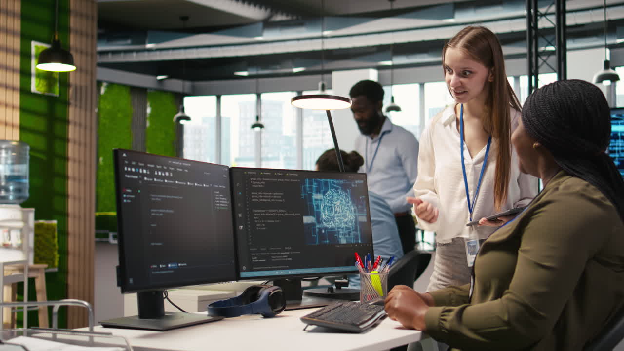 Manager Teaching Young Technician How To Develop Software Using Ai