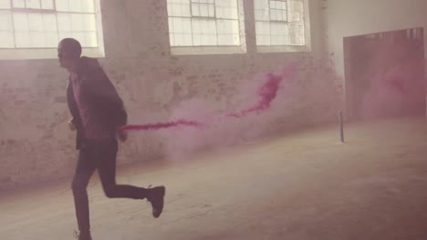 fashionable young man in an abandoned warehouse