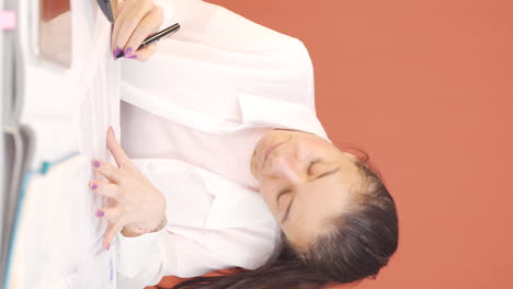 Vertical-video-of-The-woman-who-signed-the-paperwork.