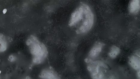 aerial view of ice. patterns of snow on a frozen lake on a winter cloudy afternoon