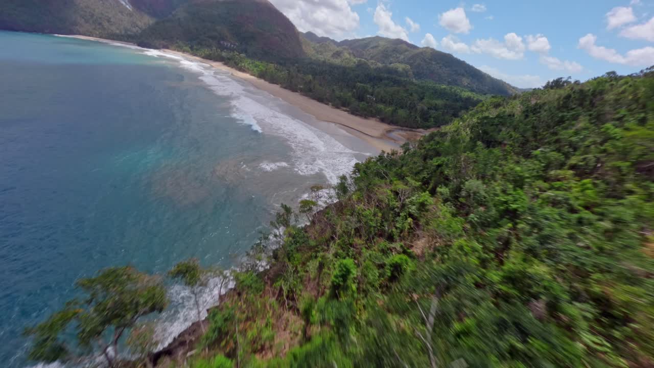 Epic fpv flight over Caribbean Sea in El Valle with R&iacute;o San Juan River at beach - Samana, Dominican Republic