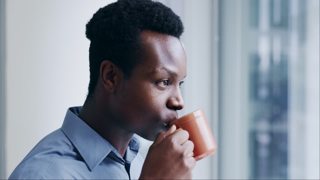 Black man, coffee and thinking with smile