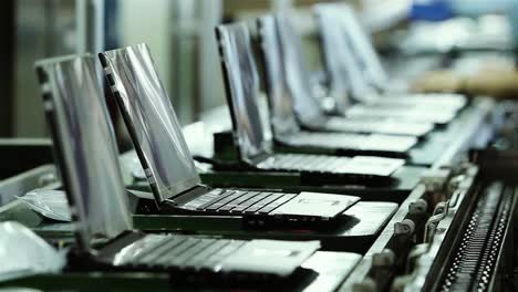 laptop factory. laptops on conveyor belt in a manufacturing plant. 4k resolution.