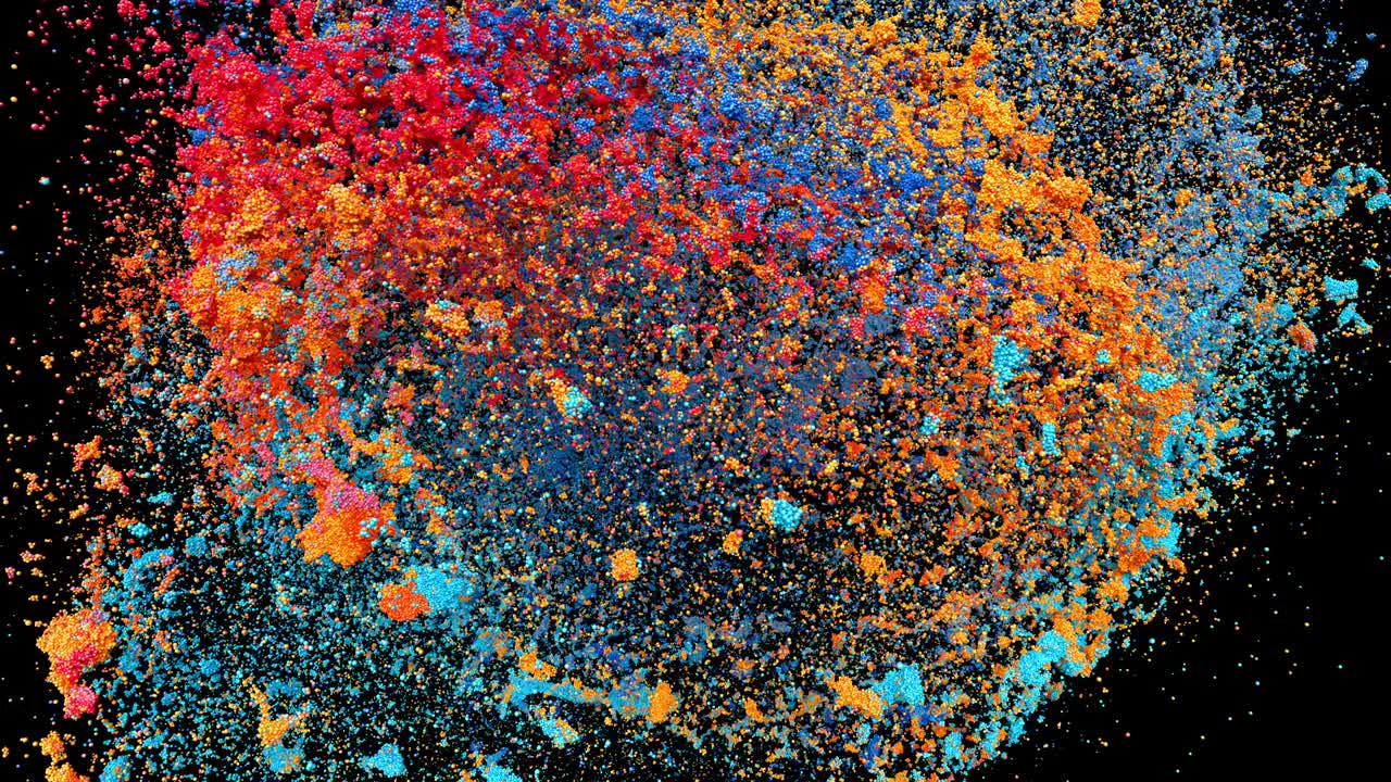Colored powder explosion on black background with alpha mask. Orbiting camera.