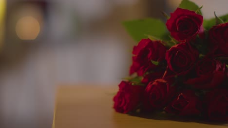 close up of bunch of red roses for valentines day on table