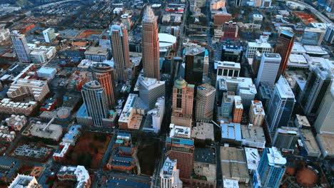 view on modern downtown of charlotte, north carolina at daytime. drone rising above the cityscape opening the view on the vast scenery