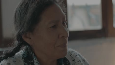 Close-up-slow-motion-shot-of-a-elderly-woman-eating-dinner-off-of-a-fork