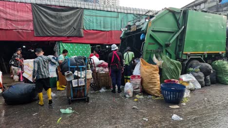 workers clearing trash at a bustling market