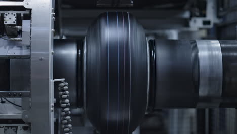 automated tyre production technology view at modern industrial factory closeup