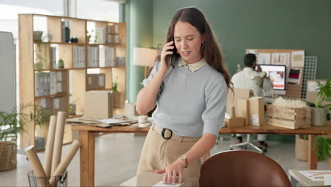 woman on a phone call in her small business office