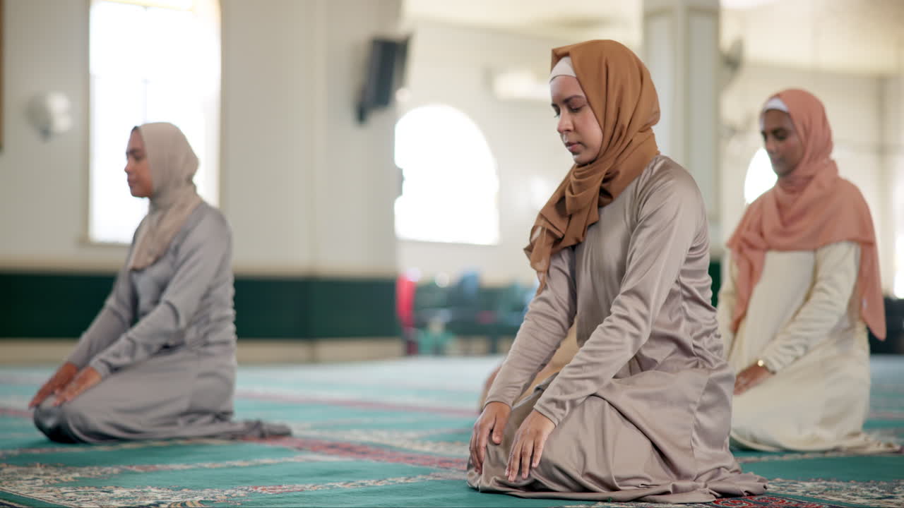 Muslim women praying in a mosque