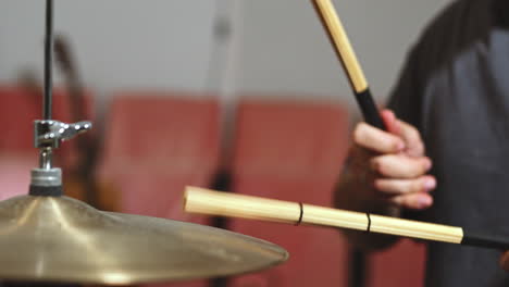 drummer play alone in studio close up of drum, stick play jazz on cymbal