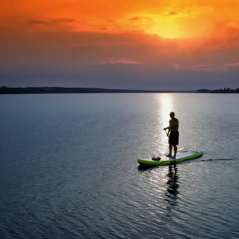 man paddling on sup board