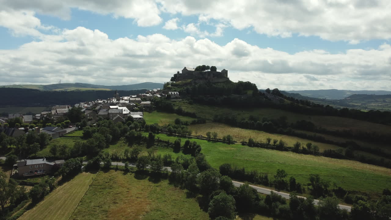 Aerial View of a Hilltop Village with a Castle