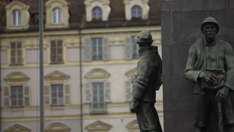 close up static shot of statues of soldiers in turin city centre