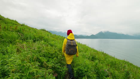 hiking in a cloudy mountainous area by a lake