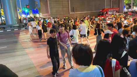 busy night street scene in thailand