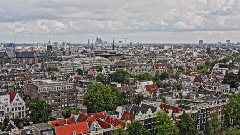 amsterdam netherlands aerial v24 drone flyover famous grachtengordel canal district capturing rows of dutch townhouses towards historic royal palace at binnenstad neighborhood - august 2021