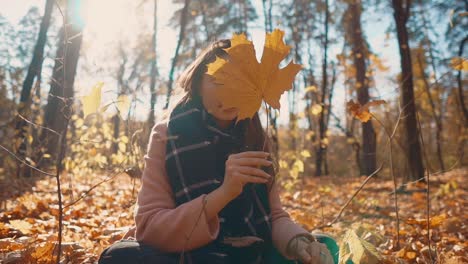 woman enjoying fall in the forest