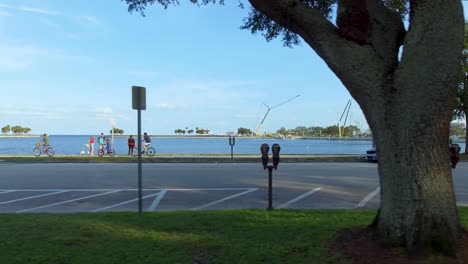 4k aerial video of bike riders and walkers on waterfront park