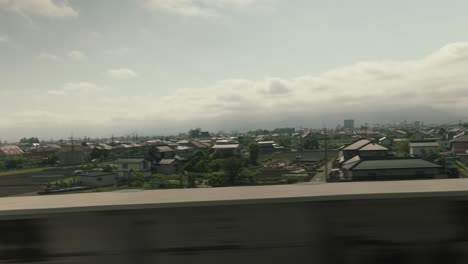 japanese suburban landscape view from a train window