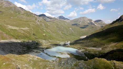 spinning aerial view of the high mountain lake in the valley of zinal, switzerland