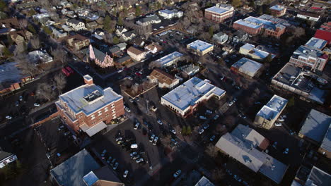 downtown flagstaff, arizona usa, aerial view of church, buildings and street traffic on winter day